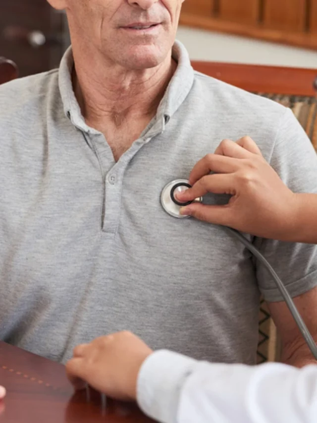 doctor measuring heartrate of a man with stethoscope